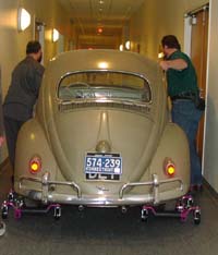 photo of the car being pushed down a narrow hall
